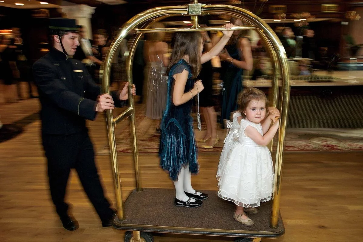 bridesmaid_on_luggage_trolley-2x-4fc585aa