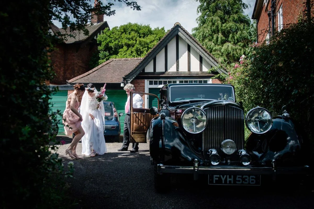 bride_with_wedding_car-2x-96de4ae7