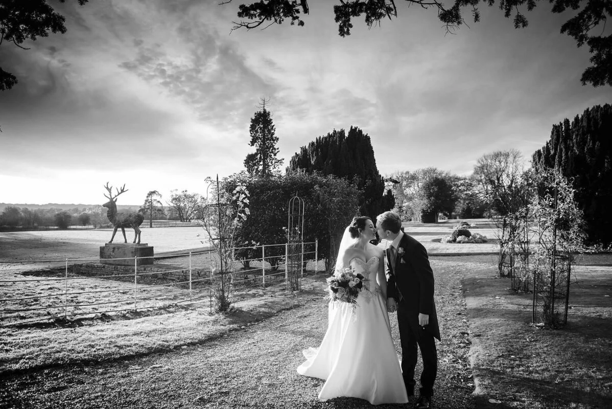 A black and white photo of a bride and groom.