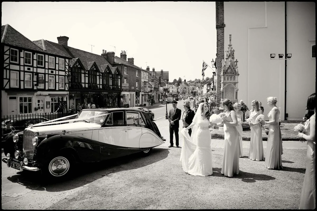 bride_with_bridesmaids_outside_Church-2x-6a39a463
