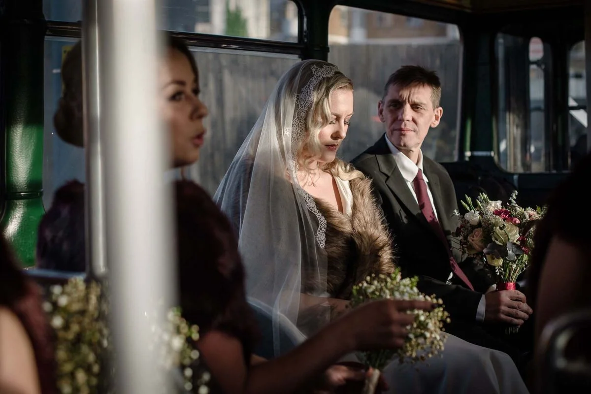 bride_and_dad_on_wedding_bus-2x-3fd516ef