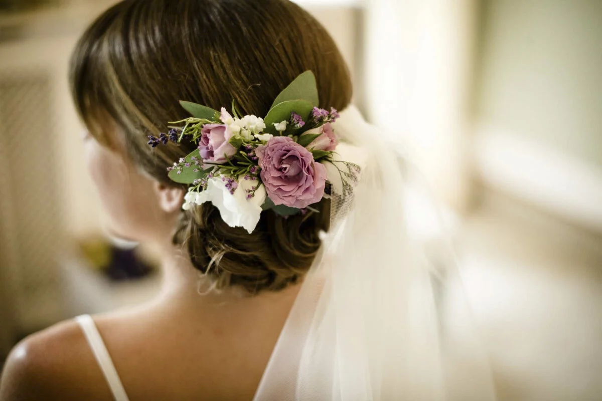 A bride with flowers in her hair.