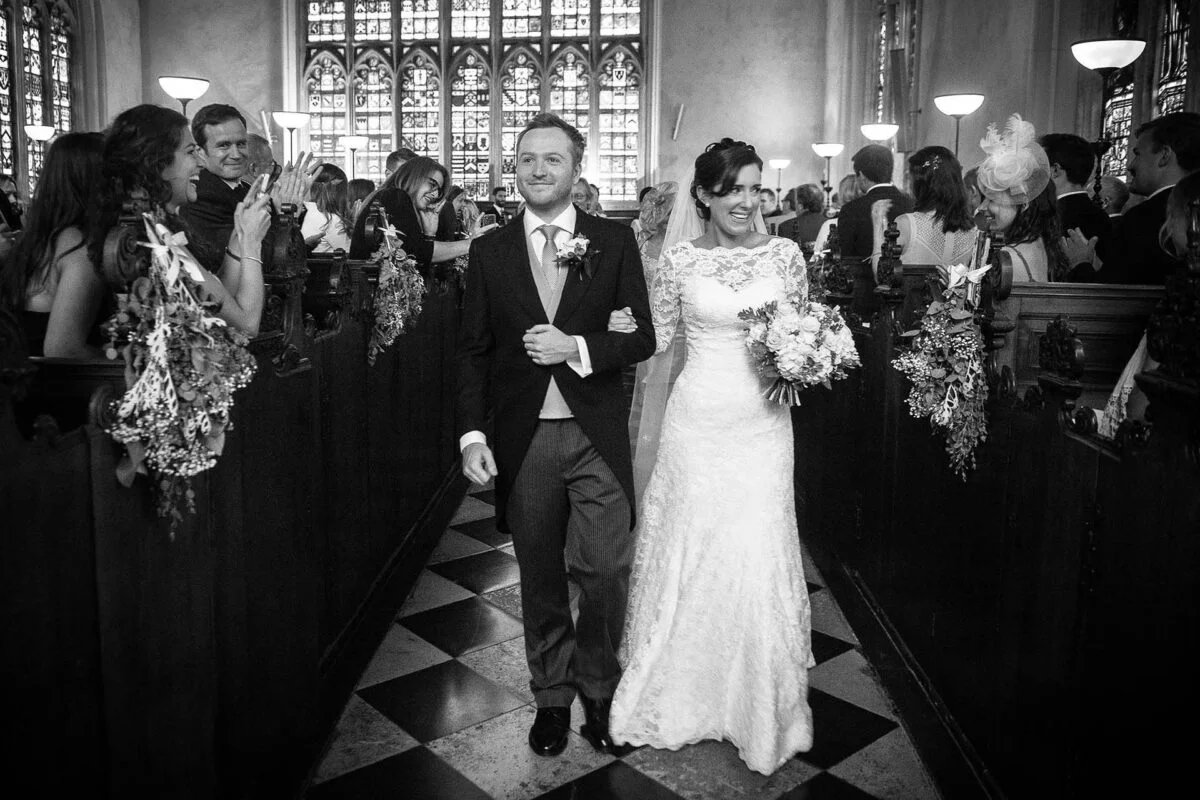 bride_and_groom_walking-down_aisle-2x-c78274de