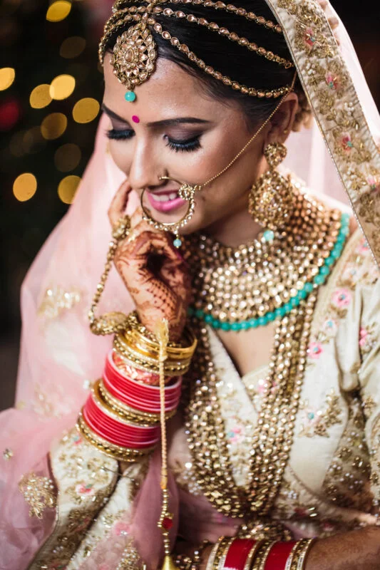 A bride in traditional indian bridal wear.
