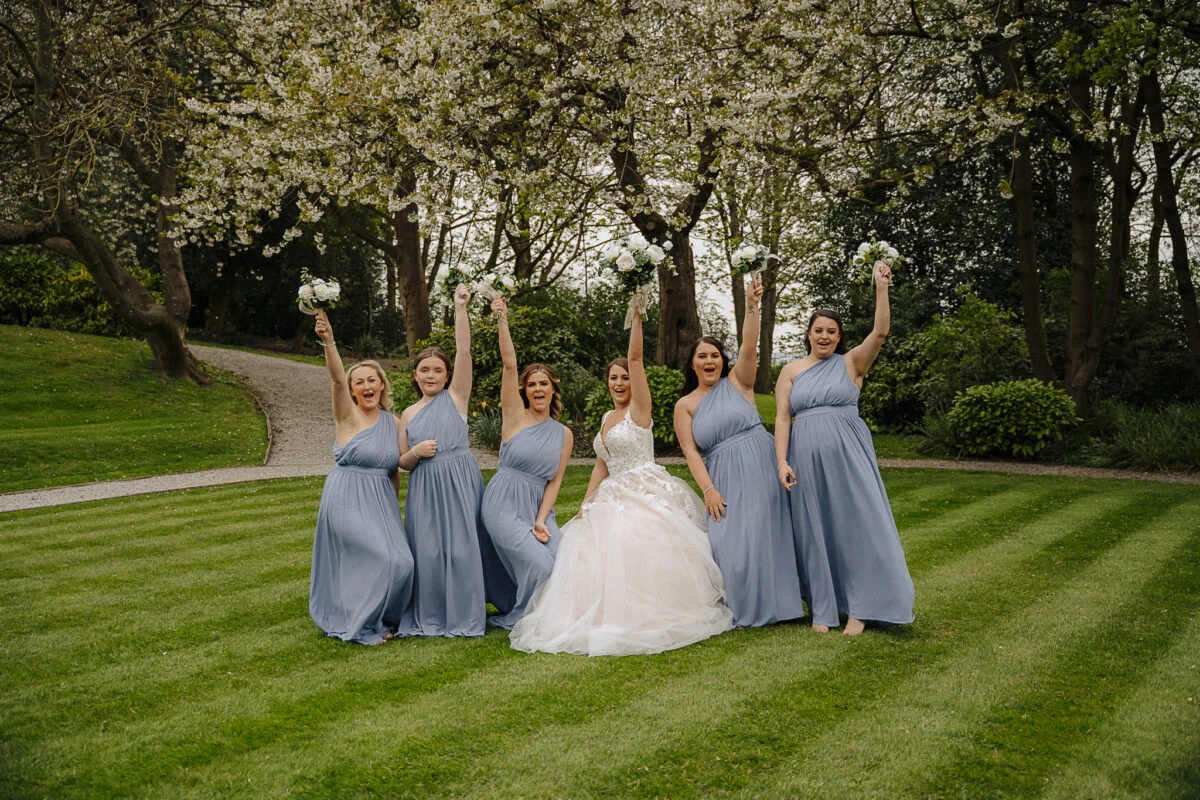 A group of bridesmaids posing for a photo.