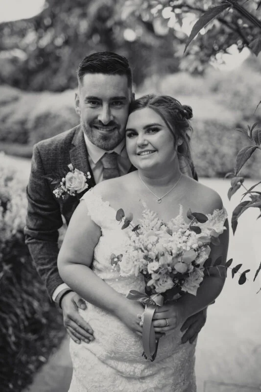 A black and white photo of a bride and groom.
