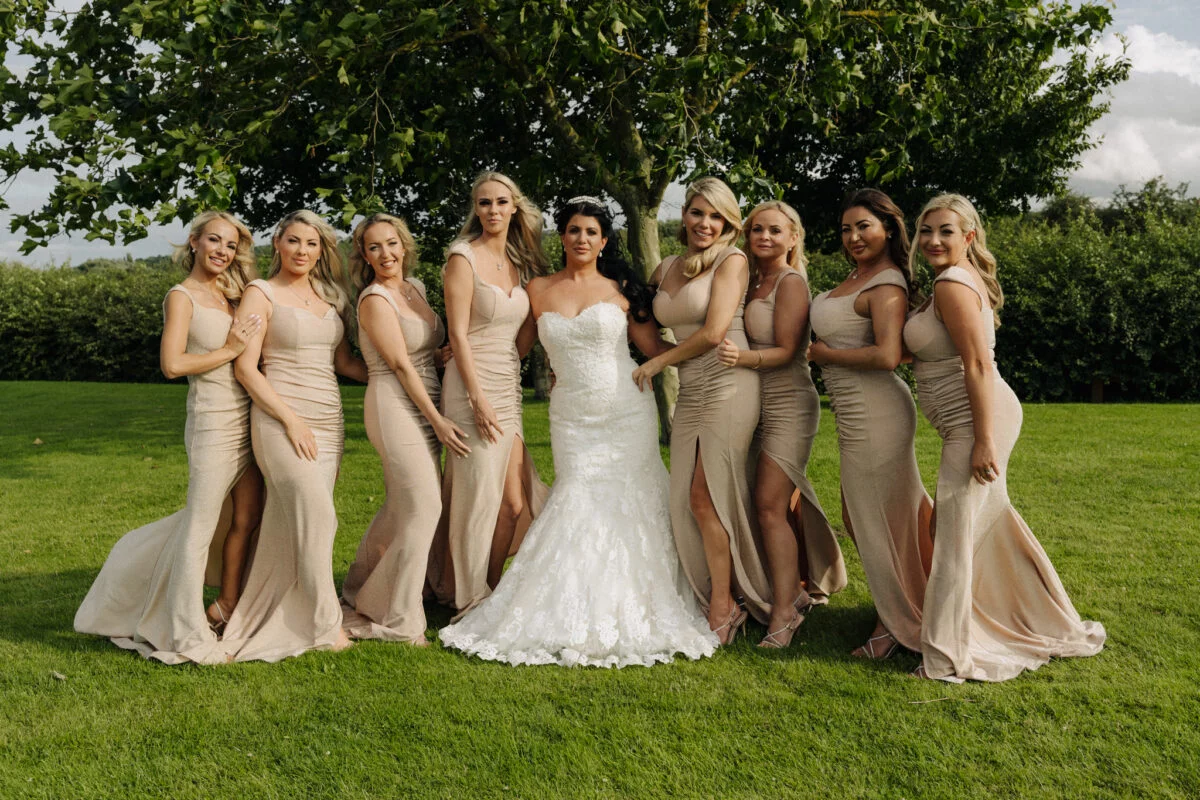 A group of bridesmaids posing for a photo.