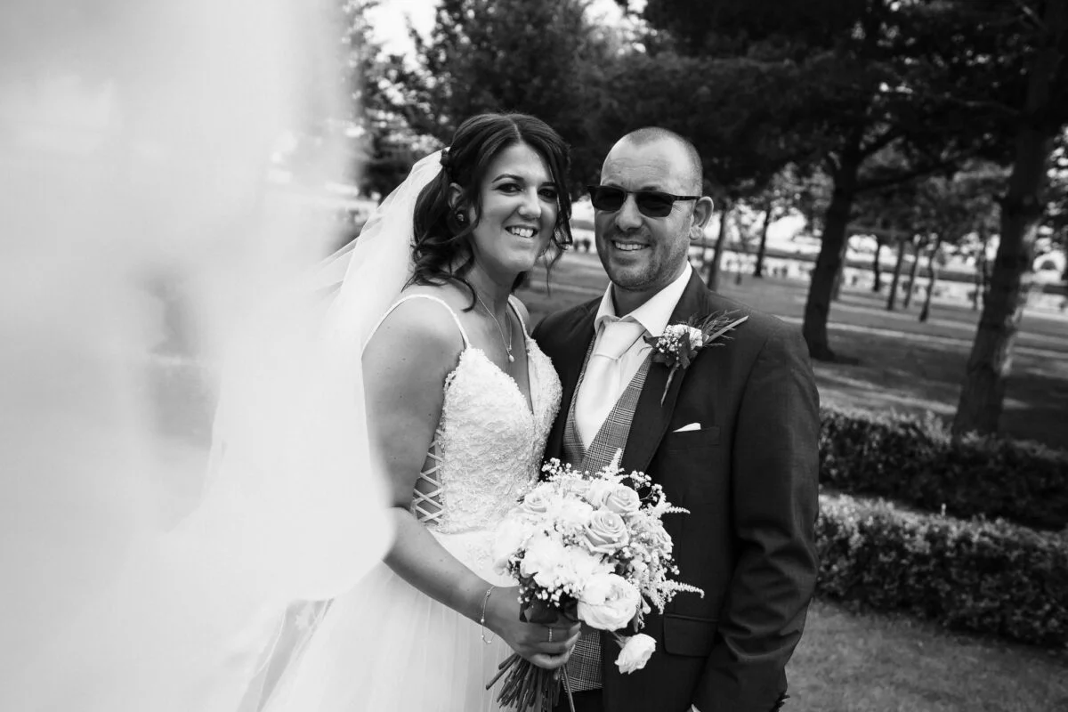 A black and white photo of a bride and groom.