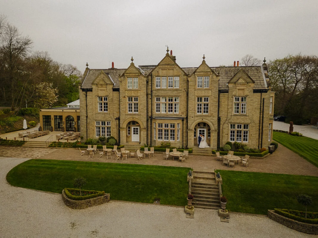An aerial view of a large mansion.