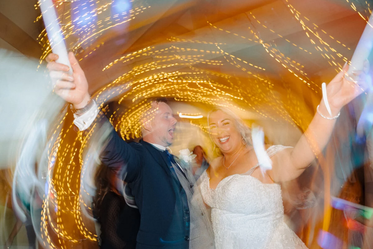 A bride and groom dancing at their wedding reception.