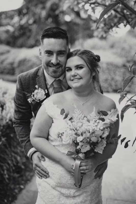 A black and white photo of a bride and groom.