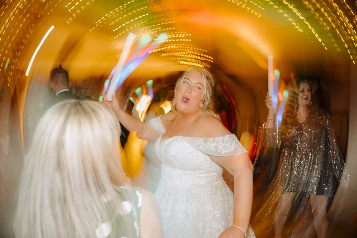 A bride and groom dancing at a wedding reception.