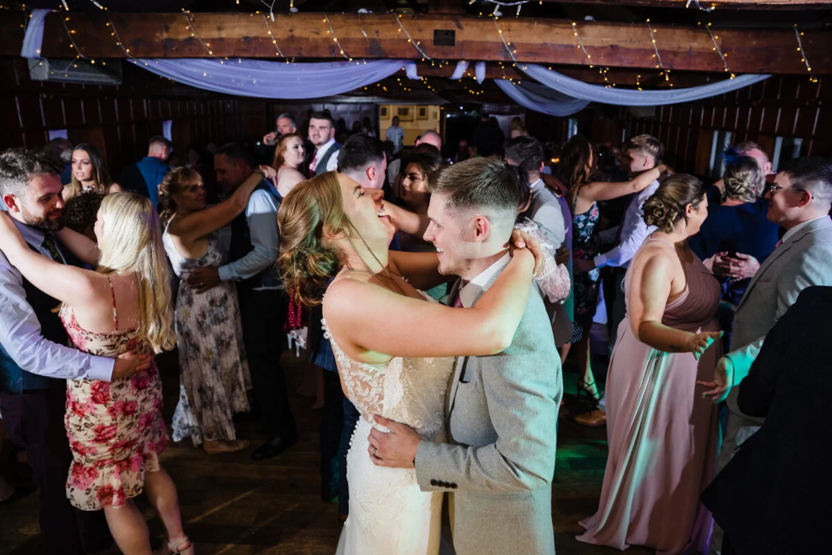A bride and groom sharing a dance at their wedding reception.