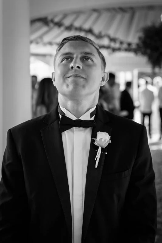 A man in a tuxedo looking at the camera.