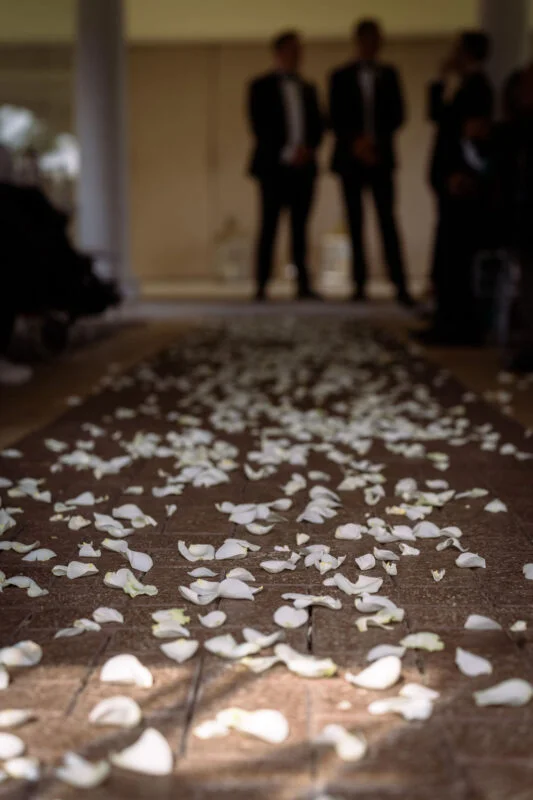 A bride and groom walking down the aisle.