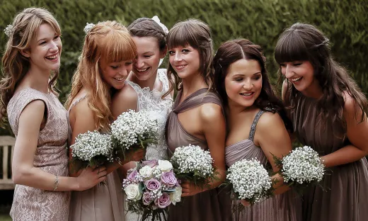A group of bridesmaids posing for a picture.