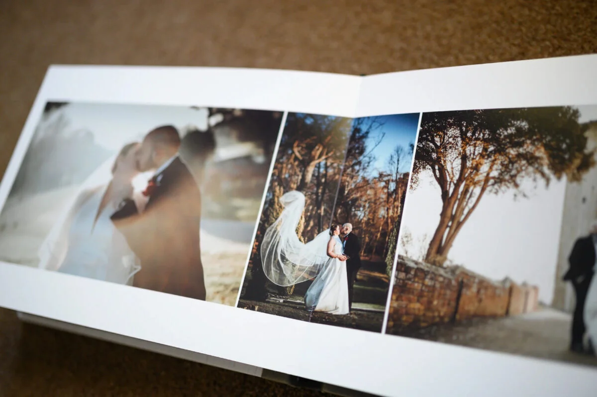 A wedding album with photos of a bride and groom.