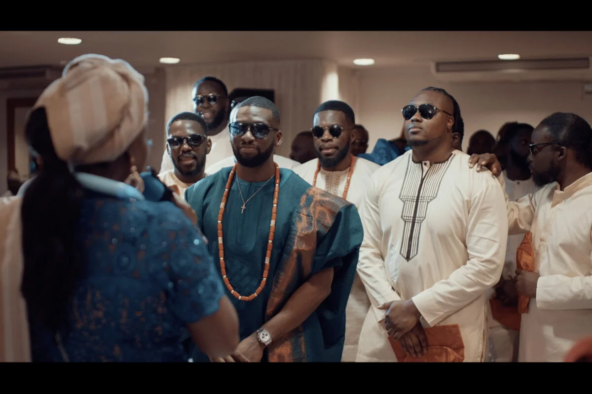 A group of men dressed in traditional african attire.
