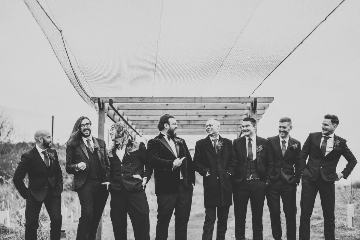 A black and white photo of a group of groomsmen.