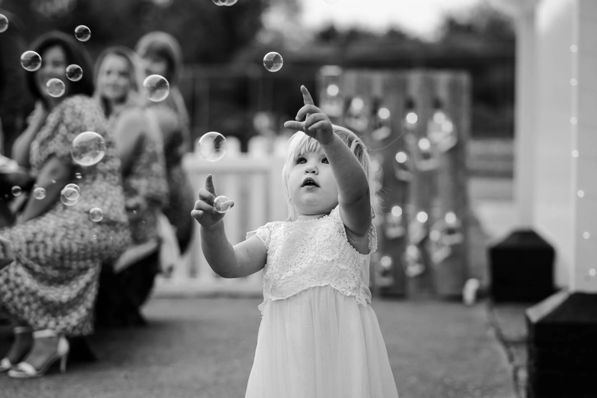 child-blowing-bubbles-wedding (listing)