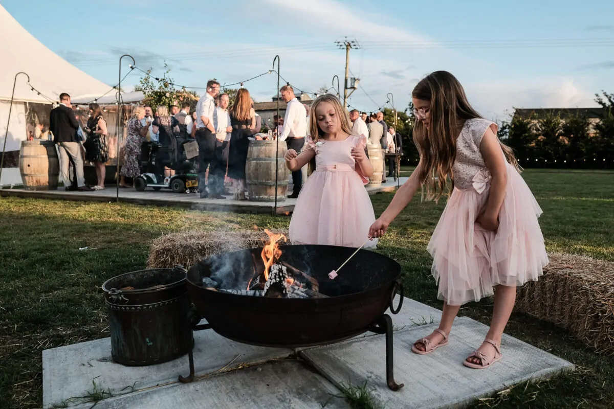 toasting-marshmallows-willow-grange-farm-chittering-wedding