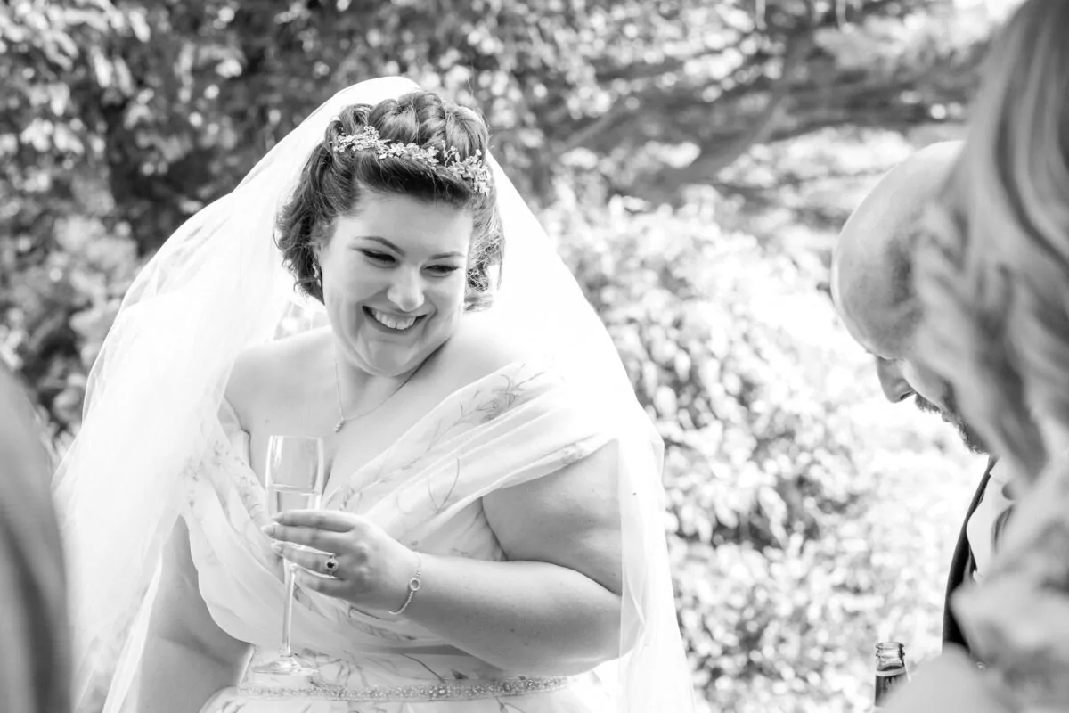 Candid moment of bride having fun