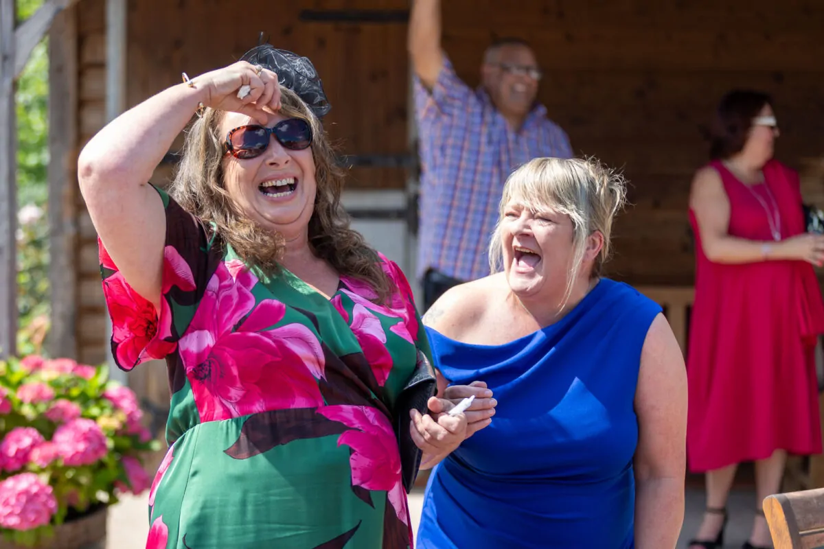 Candid Photo of Wedding Guests Having Fun