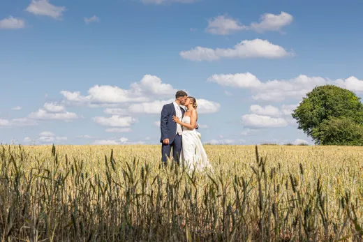 4 Bride and Groom kiss in corn field