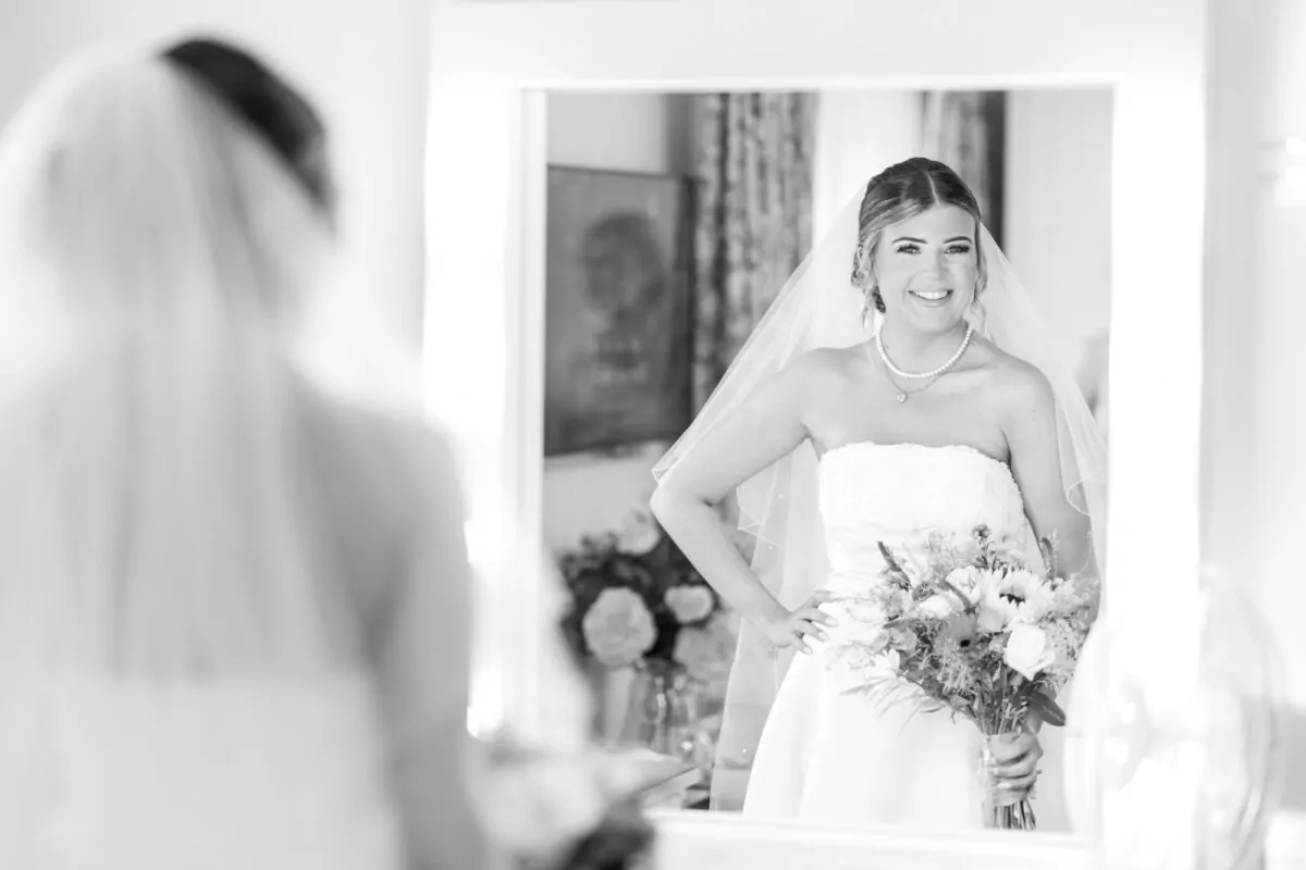 Happy Bride looking in Mirror
