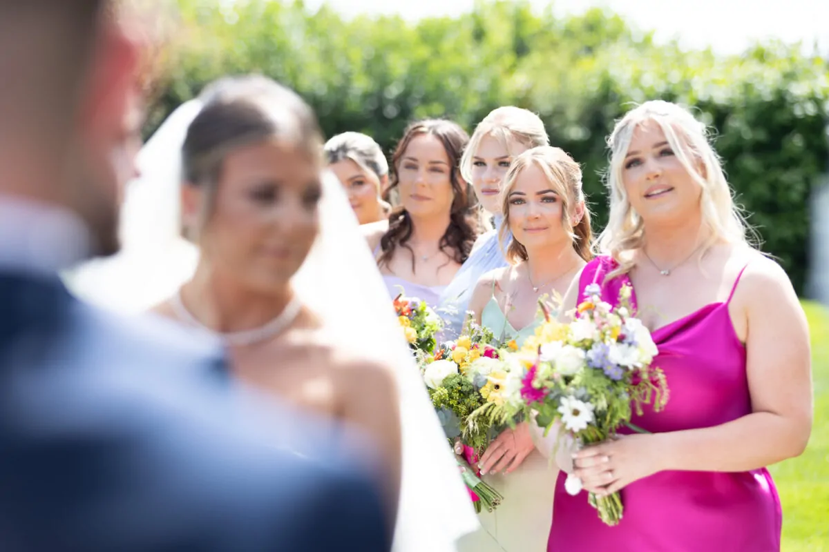 Candid Bridemaids During Wedding Ceremony