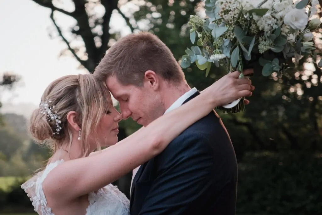 Couple garden embrace eyes closed