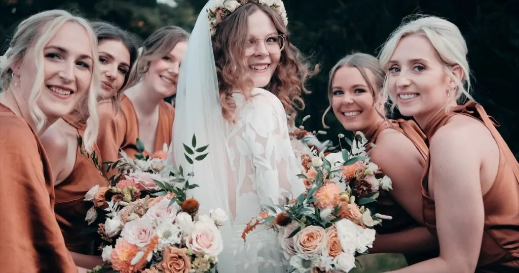 Liv and bridesmaids huddle